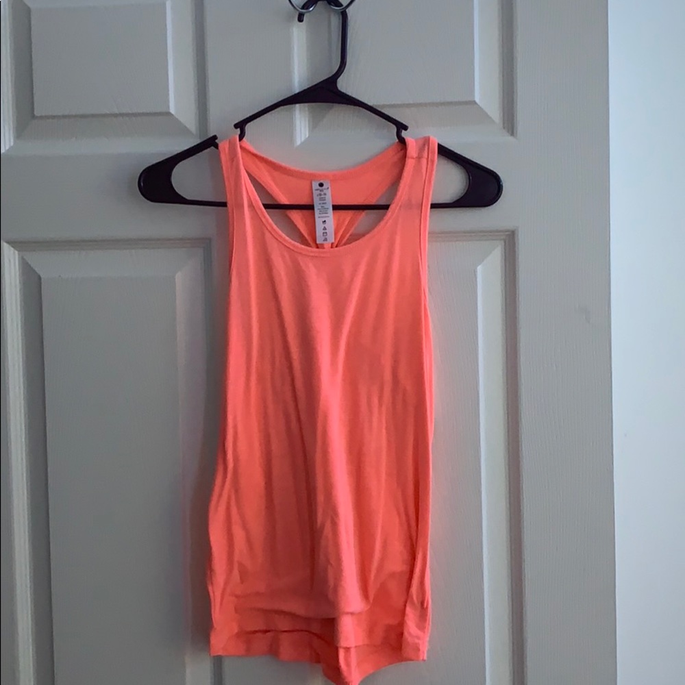 A girl tank top in a neon Orange color.